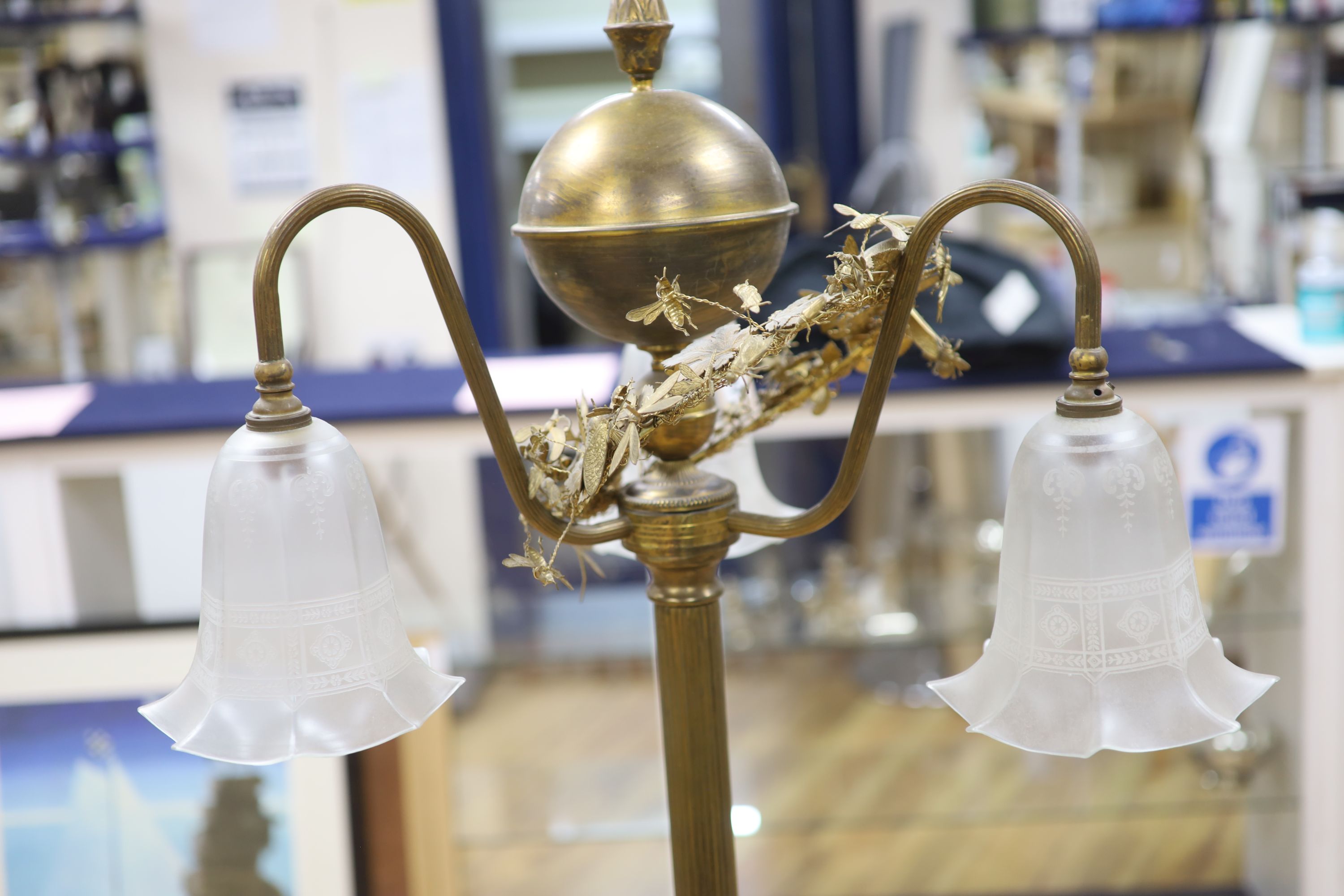 A gilt metal three branch lamp, height 92cm.